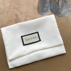 Gucci Logo Jewelry Bag Necklace Pouch New Storage Gucci Logo Dust Bag, New! 100% Authentic Genuine Gucci Sleeper To Protect & Store Your Gems Or Perfect To Complete Your Gift Presentation. Soft White (Creamy White) Silky Fabric. Perfect For Jewelry, Necklace, Ring, Bracelet, Cuff, Earrings, Sterling Silver Ring, Keychain Fob, Card Case / Mini-Wallet. Etc Rare Gucci Dust Bag Hallmark Signature Front Tag Made In Italy Authentication Tag Measures 5" Long, Flap Adjusts. As Shown 3.5"- Max 7" Tall (A Chic Gucci Clutch For Evening, Elegant White Travel Pouch, Chic White Rectangular Pouch, White Clutch Pouch With Dust Bag, Chic Gucci Clutch Bag, Designer White Envelope Bag, Everyday White Gucci Bag, Gucci Chic Evening Clutch, Gucci Black Bag As Gift