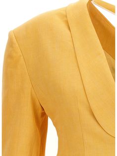 Baska' linen blend blazer jacket with asymmetric and unstructured lapels, an open shoulder with elastic lapels and pearl detail, asymmetric long sleeves, pockets and a button closure. Composition: 60% linen 26% viscose 14% polyester