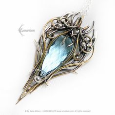 TINNARIEELH - Exclusive, Gothic, fantasy-style pendant, mix-metal necklace. Fully handmade work (oxidized and polished silver, brass). Main base gem: Blue Quartz 13Ct (2.6g).  Material: Mix Metal, Sterling Silver, Fine Silver / 925, 999, and Brass (patinated, polished and covered with protective varnish). Sterling Silver chain (optional), length: 44cm + 7 cm, (Rolo) with a decorative clasp, adjustable. Pendant length: 6,4 cm, width 3,2 cm. Color: Silver, Gold, Blue. * * * * * * * * * * * * * * * Fantasy Metal Pendant Jewelry, Bronze Metal Fantasy Necklace, Fantasy Bronze Metal Jewelry, Gold Fantasy Style Necklace For Fantasy Events, Fantasy Style Bronze Metal Necklace, Fantasy Metal Necklaces For Collectors, Unique Metal Jewelry For Fantasy Events, Fantasy Metal Pendant Necklace, Silver Pendant Jewelry For Fantasy Events