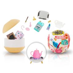 an assortment of toys including a teapot, mirror and other items on a white background