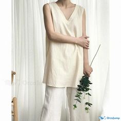 Orcajump - Simple Long Solid Colored Cotton and Linen Sleeveless Top with a Clean Scoop Neckline Beige V-neck Tank Top For Summer, Beige Cotton Sleeveless Tank Top, Beige Sleeveless Cotton Tank Top, Beige Sleeveless Vest For Beach, Beige Linen Sleeveless Tank Top, Spring V-neck Beige Tank Top, Beige V-neck Tank Top For Spring, Beige Summer Tank Top, Summer Beige V-neck Tank Top