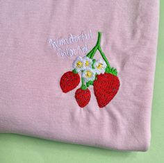 Strawberry Embroidered Tshirt 🍓🍓 Soft 100% Cotton. Unisex Fit. T-SHIRT INFO  The t-shirt is Stanley/Stella Organic 100% Cotton. We use sustainable fabric and fair trade certified. Sweatshop free and WRAP certified. T-shirt is embroidered to order. SIZING 🍓🍓 UK Sizes 🍓🍓 X-Small approx Size 6-8 Small approx Size 8-10 Medium  approx Size 12-14 Large  approx Size 16 X Large  approx Size 18 2XL approx Size 18-20 3XL approx 20-22 4XL approx 24 5XL approx 26 Embroidered Jumper, Biodegradable Packaging, Embroidered Sweatshirt, Embroidered Tshirt, Embroidered Sweatshirts, Sustainable Fabrics, Fair Trade, Strawberries, Biodegradable Products