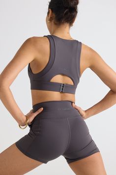 The Eva Crop Top Graphite is a form fitting crop crafted from an ultra soft durable brushed fabric for a buttery handfeel. Whether you are heading to pilates or lounging at home, you wont want to take this off. Firm support and under bust band Removable cups Back bra clasps to adjust size Printed 'ORTC Sport' Logo on back Ultra soft durable brushed fabric Designed in Australia. Made in China. Compressive Crop Top With Built-in Padding For Workout, Gray Stretch Crop Top For Yoga, Stretch Gray Crop Top For Yoga, Fitted Gray Crop Top For Yoga, Gray High Stretch Crop Top For Workout, High Stretch Gray Crop Top For Workout, Gray Fitted Activewear, Bra Friendly, Supportive Athleisure Crop Top For Pilates, Fitted Crop Top With Built-in Padding For Yoga