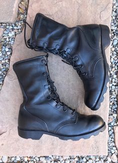 These are amazing vintage military boots. Eyelet and metal eye hooks lace up details.  Original laces, super cushioned inner area, and heavy-duty soles genuine leather throughout. [ MEASUREMENTS ] Size: Womens size 8  (marked mens size 5xw) Calf Height: 7" Heel: 1"  Width: 4" Sole Length: 11" Material: genuine leather  Color: black Label: Military Issued Condition: good, subtle wear, no flaws Military Work Boots With Reinforced Round Toe, Military Style Lace-up Hiking Boots With Reinforced Toe, Military Combat Boots With Reinforced Toe, Combat High-top Leather Lace-up Boots, Leather High-top Combat Lace-up Boots, Leather Lace-up Combat Work Boots, Military Leather Combat Boots With Round Toe, Military Lace-up Boots With Reinforced Toe, Leather Military Combat Boots With Round Toe