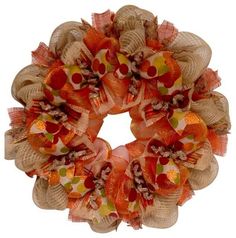 an orange and tan mesh wreath with polka dots on the front, sitting on a white background