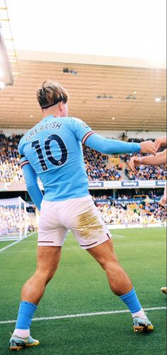 a man standing on top of a soccer field