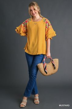 Umgee Linen blend top with layered flounce sleeves and embroidery. Fringe hemmed. Super cute blouse! Color: Mustard Sizes: S-M-L True to sizeOur model is 5' 9" wearing a small 55% Linen, 45% Cotton, importedO5/K7342 Bohemian Blouse With Ruffle Hem And Sleeves, Summer Embroidered Blouse With Bell Sleeves, Spring Embroidered Ruffle Sleeve Blouse, Embroidered Ruffle Sleeve Summer Tops, Embroidered Ruffle Sleeve Tops For Summer, Embroidered Cotton Blouse With Flutter Sleeves, Summer Floral Embroidered Bell Sleeve Blouse, Floral Embroidered Bell Sleeve Blouse For Summer, Bohemian Ruffle Sleeve Tops For Fall