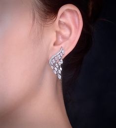 A delightfully unique pair of bridal earrings with an incredible sparkle! Adorned with flawlessly faceted cubic zirconia that capture the light in a cascade of sparkles, the earrings are rhodium plated for a bright finish which enhances the intricate detailing and conveys a modern take on old elegance. Overall length of the earring is 1.5" (approx. 4cm). Available in Silver, Rose Gold and Yellow Gold finishes. To make your choice select your preferred finish from the dropdown menu to add to cart