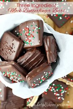 there is a bowl full of chocolates with sprinkles on it and the words three ingredient make butterfingere bars