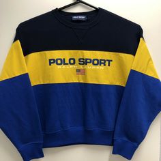 Polo Sport Ralph Lauren Crewneck Flag Sweater Pullover Blue Yellow Womens L New. Condition is "New with tags". Measures approximately 24.5 inches in length, 25 inches pit to pit, and has a sleeve length of 20.5 inches. I believe this is Women’s sizing, please check the measurements provided before purchasing!!! The yellow fabric is polyester. The darker color is a dark Blue. Please look at the pictures closely!!!!! Blue Tops With Ribbed Collar For Streetwear, Blue Top With Ribbed Collar For Streetwear, Sporty Long Sleeve Blue Sweater, Sporty Blue Long Sleeve Sweater, Blue Long Sleeve Sporty Sweater, Polo Clothes, Polo Crewneck, Ralph Lauren Crewneck, Flag Sweater