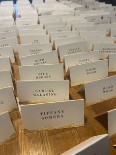 there are many place cards on the table for someone to write their name or date