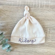 Wrap your little one in personalized comfort with our Hand Embroidered Baby Hat, custom stitched with your baby's name. Made from soft, breathable cotton, this unique newborn beanie is the perfect baby shower gift and a cherished keepsake. Each hat is carefully hand embroidered, ensuring a one-of-a-kind touch. Ideal for newborns and infants, this personalized baby hat combines style and sentiment, making it a must-have for any new parent. Cotton Hat, One Size Fits Most, Soft Cotton Cap, White Personalized Cotton Hat, Personalized White Cotton Hat, Adjustable Soft Hat For Gifts, Adjustable Soft Hat As A Gift, Soft Adjustable Hat As A Gift, Adjustable Cream Soft Hat, Adjustable Soft Cream Hat