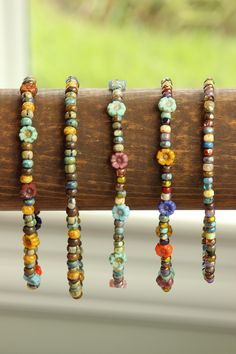 These one-of-a-kind Happy Anklets can be made with either my boho or treasure bead blend of gorgeous Czech Glass. The knot hider is stainless steel and therefore hypoallergenic and tarnish free. To pick your perfect size, measure your ankle with a soft measuring tape and add a 1/2 inch. The most common size is 9 inches. I use high quality stretch and prestretch, so it won't stretch out on you! Adjustable Bohemian Czech Glass Beaded Bracelets, Adjustable Czech Glass Beaded Bracelets For Festival, Bohemian Czech Glass Beaded Bracelets For Beach, Bohemian Czech Glass Bracelets For Festival, Rustic Beaded Bracelets With Round Beads For Festivals, Nickel-free Bohemian Beaded Bracelets For Festivals, Nickel Free Bohemian Beaded Bracelets For Festivals, Measuring Tape, Anklet Jewelry