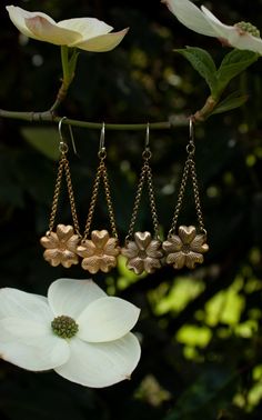 These are wonderfully detailed dogwood flower earrings for all you fellow dogwood tree lovers, flower lovers, and botanical besties out there. They are a great medium size dangle earring and are super lightweight, yet durable, made of solid (not plated) raw brass with solid sterling silver ear hooks. There are two finishes you can choose from either with a patina to enhance the antique feel and highlight the texture, or shiny. Please select your preference from the drop down menu length: 2 1/2 i Vintage Gold Flower Shaped Earrings, Vintage Gold Flower-shaped Earrings, Vintage Metal Flower Earrings, Vintage Flower Charm Dangle Earrings, Vintage Flower Shaped Earrings, Vintage Flower-shaped Pierced Earrings, Vintage Flower-shaped Earrings For Anniversary, Vintage Gold Earrings With Flower Charm, Vintage Drop Earrings With Flower Charm