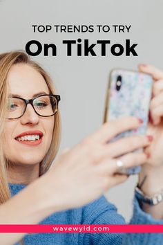 a woman wearing glasses looking at her phone with text overlay that reads top friends to try on tiktok