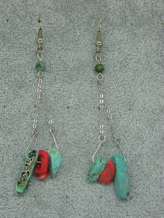 Earring with Polished Turqoise Beads and Tusks and Polished Coral Nuggets on Antique Silver coloured stainless steel eyelets and hook. With small silicone push back to secure safely in place. Turquoise Metal Dangle Beaded Earrings, Turquoise Metal Beaded Dangle Earrings, Turquoise Beaded Dangle Earrings, Red Coral, Silver Color, Favorite Jewelry, Antique Silver, Turquoise Necklace, Jewelry Earrings Dangle