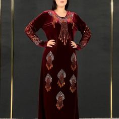 Introducing our exquisite 2023 African Velvet Evening Dress, a captivating blend of elegance and cultural heritage. This dress is more than just a piece of clothing; it's a symbol of grace and tradition, designed to make you feel like a queen.Crafted with meticulous attention to detail, this dress boasts the rich texture of velvet, providing a luxurious feel against your skin. The long sleeves add an air of sophistication, making it suitable for various formal events and celebrations. Whether yo Kaftan Dress Velvet, Dresses For Women Long Sleeve, Luxury V-neck Velvet Dress For Women, Red Embroidered Long Sleeve Kaftan, Velvet Caftan Moroccan, Luxury V-neck Sequined Kaftan, Muslim Dresses, Velvet Evening Dress, African American Fashion