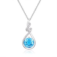 A dazzling display of ocean hues!A stunning 1.8 carat Swiss blue topaz is the showstopping centerpiece of this sparkling pendant.Gorgeous embellishments of lab created sapphires cascade down the center of the pendant for an artful contrast.This stunning teardrop pendant perfectly captures the astoundingly rich hues of the warm summer sun shining over a bright, clear ocean.Artfully crafted of solid sterling silver, this sparkling creation glimmers from an 18" rope chain. Ocean Hues, Ocean Inspired Jewelry, Danbury Mint, Blue Topaz Pendant, Swiss Blue Topaz, Accessories Jewelry Necklace, Ocean Inspiration, Rope Chain, Blue Sea