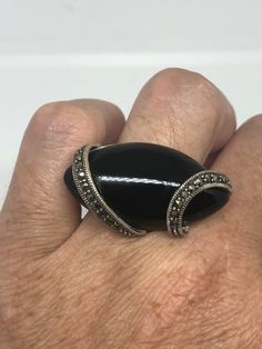 Vintage Genuine Black Onyx Silver Marcasite Ring https://www.etsy.com/listing/633185903/vintage-genuine-black-onyx-silver?utm_source=crowdfire&utm_medium=api&utm_campaign=api Victorian Black Sterling Silver Rings, Victorian Style Black Sterling Silver Rings, Victorian Black Oval Rings, Antique Black Cabochon Rings, Victorian Style Black Rings With Polished Finish, Vintage Sterling Silver Ring With Black Enamel, Victorian Black Rings With Polished Finish, Vintage Sterling Silver Rings With Black Enamel, Black Victorian Rings With Polished Finish