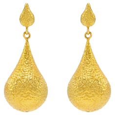 The Bali 20k Gold hand hammered, one of a kind earrings are like wearing royalty! The luxurious color of the gold complimented with the perfect amount of hammering is ideal for day or night. The vibe here is make a wish and watch the magic happen. Spectacular to elevate your style day or night! Unparelleled luxury! The Essentials Collection is the ultimate in ease and beauty. Effortlessly transitions from day to night. These are the foundational pieces that all other collections were born. 20k gold, hand made and textured with a gorgeous hand hammered finish. Deliberately made to add on and pair with all Tagili collections. These are the staple pieces for an easy going vibe yet highly glamorous style. The Tagili Promise: With every purchase a portion of the proceeds goes to a local woman's Luxury Hammered Earrings For Anniversary, Luxury Hammered Drop Earrings, Traditional Hammered Yellow Gold Earrings, 22k Yellow Gold Hammered Earrings, Hand Forged Earrings For Formal Occasions, Luxury Hammered Gold Earrings, Gold Hand Forged Drop Earrings, Hammered Teardrop Earrings For Formal Occasions, Luxury 22k Gold Earrings For Formal Occasions