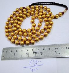 vintage tribal 22 k gold and wax filled round beads necklace from Madurai south India. As worn by all Chettiar(caste) people, Highly sort after piece for any serious collectors will look fabulous with a modern crisp white shirt. Total length-40 inches, we can adjust the length, size of beads- 9 mm, total weight-53 grams, Material -22-carat gold and wax filled. Gold Beads Necklace, Round Bead Necklace, Necklaces Pendant, Gemstone Bangle, 22 Carat Gold, Gold Bead Necklace, Madurai, Necklace Long, Beads Necklace