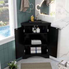 a bathroom with a sink, mirror and towels on the shelf in front of it