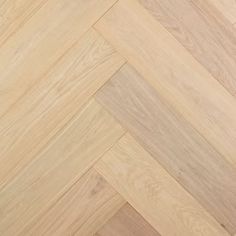 an image of wood flooring that looks like herringbones