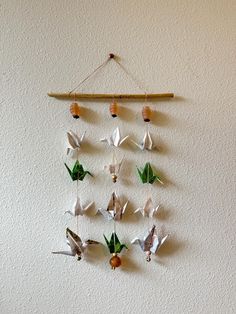 a group of birds hanging from a wall