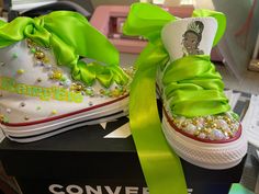 Custom decorated Princess and the frog, Princess Tiana themed converse. Professional grade vinyl is used for the design on the shoes that holds up to washing. Please choose the appropriate converse shoe size for your child. All orders will come with the pearls designed on the shoes as seen in the pictures. If you prefer rhinestones covering the toe of the shoes please leave that request in the personalization section. Don't forget to include the name if desired to go on the shoes. If you would l The Frog Princess, Personalized Converse, Princesa Tiana, Bling Converse, Converse Custom, Frog Princess, Shoe Ideas, Custom Converse, Personalized Shoes