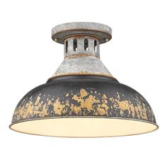 an industrial style light fixture with rusted metal and white paint on the bottom,