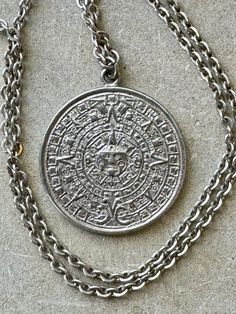 Sterling silver vintage Mexican Myan Calndar  Sun pendant medallion necklace Chain measures about 20 inches around Vintage Coin Necklace With Large Pendant, Silver Symbolic Medallion Necklace, Silver Etched Medallion Necklace, Silver Medallion Necklace With Etched Details, Antique Silver Etched Pendant Necklace, Silver Etched Pendant Necklace, Silver Medallion Necklace In Symbolic Style, Antique Silver Necklace With Large Pendant, Vintage Medallion Coin Necklace With Large Pendant