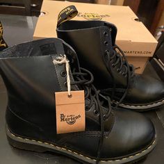 The 1460 Is The Original Dr. Martens Boot. Its Instantly Recognizable Dna Looks Like This: 8 Eyes, Classic Dr. Martens Smooth Leather, Grooved Sides, A Heel-Loop, Yellow Stitching, And A Comfortable, Air-Cushioned Sole. These Are Labeled And Were Advertised As “Silver,” But At A Glance, They Look Black. If You Look Closely, They Appear To Be A Dark Pewter Color With A Slight Metallic Sheen. Classic Black Boots For Streetwear, Classic Black Work Boots For Streetwear, Leather Boots Men, Doc Martens 1460, Doc Martens Black, Black Leather Combat Boots, Dark Pewter, Dr Martens Black, Pewter Color