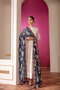 Heavily Embellished Floral White Pakistani Salwar Kameez Party Wear comes in a blissfully ethereal design Sepal features white canvas layered with Applique work Centre panel in Parsigara embroidery. Embroidered Kameez: This elegant Pakistani salwar Suit Paired with paneled Kameez is adorned in mono tone resham, silver and white sequin. Paired with deep colored embroidered organza border. Aesthetically rich pattern is rendered in resham and French knots. Embroidered Trousers: Pakistani Salwar Sui White Bollywood Lawn Suit For Reception, White Chinon Dress With Intricate Embroidery, Bollywood Style Lawn Suit With Sheer Dupatta For Reception, White Lawn Suit With Zari Work For Reception, White Organza Unstitched Suit For Reception, White Chinon Designer Dresses, White Floor-length Chinon Salwar Kameez, White Salwar Kameez With Intricate Embroidery For Diwali, White Dresses With Resham Embroidery In Chinon