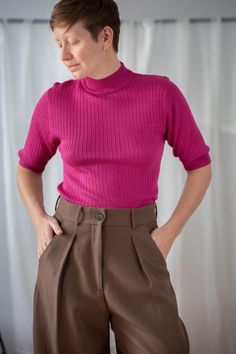 Buy 3 items and get 30% off your entire order. Limited offer. All orders are shipped via FedEx. Shipping to the US typically takes 2 to 3 business days, while within the EU, it takes 2 to 6 business days. This vintage fine knit silk top is the perfect base for any outfit. It comes in a vibrant magenta color, featuring a mock neck and short sleeves. With its slim fit and ribbed design, it offers both style and versatility. Material: 100% silk Condition: great vintage condition Size: best fits siz Pink Short Sleeve Knit Tops, Pink Knit Short Sleeve Tops, Pink Knit Tops With Short Sleeves, Pink Knit Top With Short Sleeves, Pink Fitted Fine Knit Top, Pink Fine Knit Sweater For Workwear, Ribbed Short Sleeve Tops For Winter, Pink Crew Neck Top For Work, Pink Crew Neck Sweater For Work