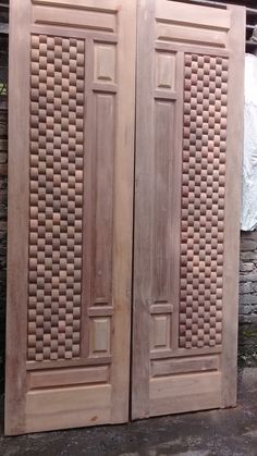 two wooden doors sitting next to each other