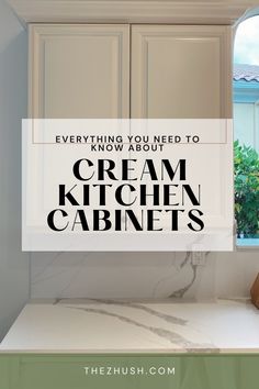 a kitchen cabinet with the words everything you need to know about cream kitchen cabnets