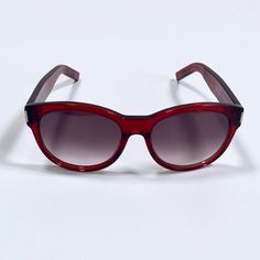 Authentic Saint Laurent Paris Burgundy Red Sunglasses. These Sunglasses Are In Good Condition With Only Minor Wear And Tear. Worn Only A Few Times. The Lenses Do Not Have Major Scratches, And The Frames Are In Good Condition. No Case. Saint Laurent Accessories, Red Sunglasses, Saint Laurent Paris, Oval Sunglasses, Burgundy Red, Sunglasses Accessories, Saint Laurent, Lenses, Women Accessories