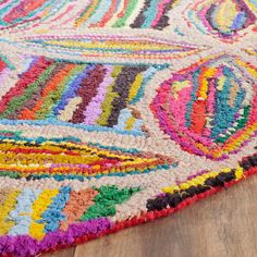 a multicolored area rug on the floor