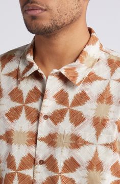 A distinctive geometric print neatly patterns a shirt made of linen and cotton with a hem designed specifically to be left untucked on sunny days. 29" length, 48" chest (size medium) Front button closure Spread collar Short sleeves Chest patch pocket 55% linen, 45% cotton Machine wash, tumble dry Imported Ss25 Prints, Digital Print Fashion, Tshirt Details, Printed Shirts Men, Textile Prints Design, Shirt Prints, Africa Art, Pattern Play, Business Shirts