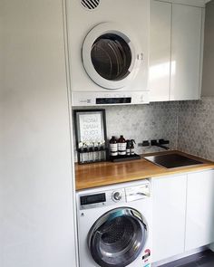 a washer and dryer in a small kitchen