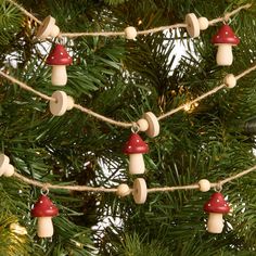 christmas lights are hanging from the branches of a tree