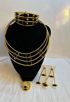 Nigerian bridal wedding gold-plated jewelry set. Necklace, earrings, bracelets and adjustable ring. Costume jewelry,Women gold color jewelry set, Jewelry for all events type. Fashion jewelry  Jewelry Set include: Necklace, earrings, bracelets, ring. Material: gold plated, copper  No refund/ no exchange/No Returns  Kindly allow a difference of the picture/pattern of your item(s) between the real-life image and the photographic image on the website. Gold-plated Metal Jewelry Sets, Gold-plated Jewelry Sets For Party, Plated Metal Jewelry Sets For Party, Gold Plated Jewelry Sets For Party, Adjustable Gold Costume Jewelry Sets, Elegant Jewelry Sets With Adjustable Chain, Gold-plated Metal Jewelry, Elegant Adjustable Bridal Sets For Formal Occasions, Gold Metal Jewelry Sets For Party