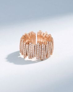 Experience timeless elegance with this Classic Gold Full Pave Milli Band, expertly crafted from 18-karat gold with pave white diamonds. This flexible ring features a unique design with meticulously strung pieces of yellow, white, or rose gold on an 18-karat spring gold wire, offering both comfort and sophistication. Details 18k yellow gold, rose gold or white gold 1.55 carats of pave white diamonds 12mm width Ref: BAR1072 Rainbow Sapphires, Ruby Sapphire, Tennis Necklace, Classic Gold, Gold Wire, White Rose Gold, White Diamonds, Eternity Bands, Diamond Wedding Bands