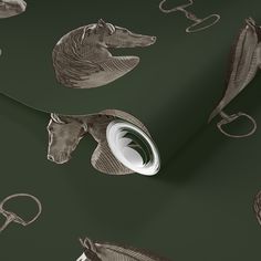 an animal wallpaper with horses and horseshoes on it's green back ground