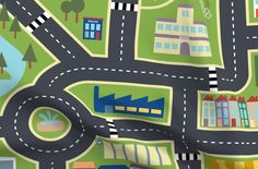 a child's play mat with cars and buildings on it