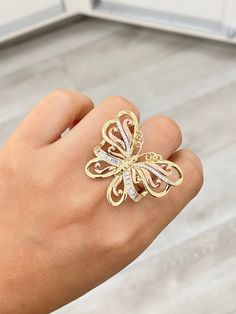 14K Large Three Toned Butterfly Ring -Solid 14K Gold -Beautiful butterfly design with yellow and rose gold -Round and baguette style white cubic zirconia stones -Available in a size 7 US -Great piece for a special event -Definitely a statement piece ! -Perfect for butterfly lovers (Message us if you have any other questions) Luxury Diamond Butterfly Ring, Gold Luxury Butterfly Ring For Formal Occasions, Formal Yellow Gold Butterfly Ring With Cubic Zirconia, Luxury Gold Butterfly Ring For Anniversary, Luxury Gold Butterfly Ring For Formal Occasions, Luxury Gold Butterfly Ring, Diamond Butterfly Ring In Yellow Gold, Luxury Gold Butterfly-shaped Ring, Gold Butterfly Ring With Diamond Accents For Formal Occasions