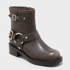 Elevate your boot collection with these Connor Harness Buckle Ankle Boots from Universal Thread™. Made from faux leather, these boots are designed with a round closed toe and harness straps accented with silver-tone buckles, nail heads and a ring for lending stylish moto flair. They sport a side zipper closure for a smooth fit and boast a cushioned footbed and soft fabric lining for all-day comfort, complemented by a 1.75-inch block heel that adds height. Universal Thread™: Found exclusively at Heel Combat Boots, Beach Socks, Boot Collection, Chelsea Rain Boots, Western Ankle Boots, Vegan Boots, Buckle Ankle Boots, Harness Boots, Rubber Boot