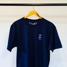 Celebrate your love for Tottenham with this stylish T-shirt featuring a unique embroidered patch inspired by the iconic 1994/95 away kit. The can design captures the essence of a classic era in Tottenham's history. Made from high-quality cotton, this T-shirt offers comfort and durability, perfect for everyday wear or showing off your team pride. It's an ideal addition to any Tottenham fan's wardrobe. Get yours today and relive the nostalgia! Size Guide: Small - Chest (To Fit): 34/36" / Length: 7 Navy Crew Neck T-shirt For Streetwear, Crew Neck Top With Embroidered Logo For Fans, Navy Screen Print T-shirt For Streetwear, Cotton Crew Neck Top With Embroidered Patch, Blue Crew Neck T-shirt With Embroidered Graphics, Casual T-shirt With Embroidered Patch And Crew Neck, Casual Crew Neck T-shirt With Embroidered Patch, Casual T-shirt With Embroidered Patch, Crew Neck Tops With Embroidered Patch For Streetwear