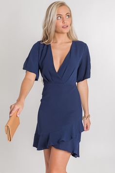 Ellis Sheath Dress, Navy :: NEW ARRIVALS :: The Blue Door Boutique Flowy V-neck Dress With Ruffle Hem And Short Sleeves, Flirty Dress With Ruffle Hem And Surplice Neckline, Fitted Dress With Surplice Neckline And Ruffle Hem, Elegant Flutter Sleeve Mini Dress For Date Night, Brunch Dress With Ruffle Hem And Surplice Neckline, Ruffle Hem Flutter Sleeve Dresses For Date Night, Chic Flutter Sleeve Lined Dresses, Ruffled Surplice Neckline Dress For Date Night, Ruffled Dresses With Surplice Neckline For Date Night