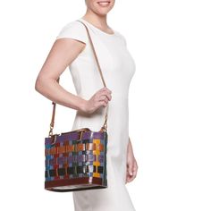 You're sure to love the colorful and unique style of this AmeriLeather basket-style handbag. You're sure to love the colorful and unique style of this AmeriLeather basket-style handbag. HANDBAG DETAILS 9"H x 5.5"W x 12.5"L Removable/adjustable crossbody strap Shoulder strap length: adjusts to 44 in. Adjustable handles Handle: 5.5'' drop Water repellent Copper-tone hardware Zipper closure Interior: 2 slip pockets, 1 zip pocketCONSTRUCTION & CARE Body: canvas/leather Wipe clean Imported Size: One Chic Leather Basket-shaped Bucket Bag, Chic Leather Basket Bucket Bag, Chic Leather Bucket Bag In Basket Shape, Everyday Leather Basket Shoulder Bag, Chic Leather Bucket Bag With Basket Shape, Multicolor Top Handle Bucket Bag With Detachable Handle, Leather Woven Bucket Bag, Multicolor Leather Satchel With Adjustable Strap, Leather Basket Shoulder Bag For Daily Use